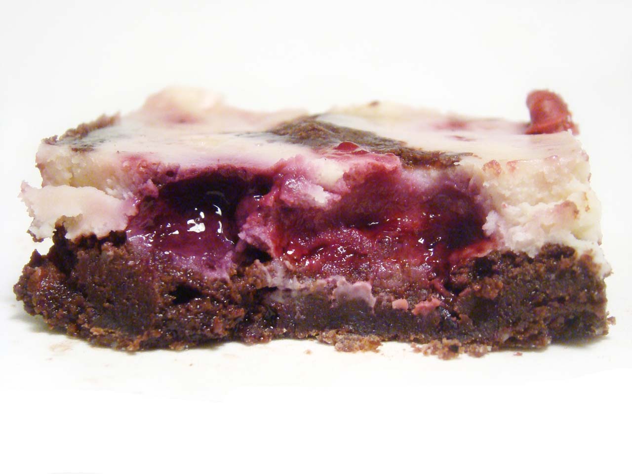 Brownie marmolado cheesecake con frutos rojos