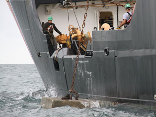 USCG adds concrete to artificial reef near Yarmouth, Massachusetts.