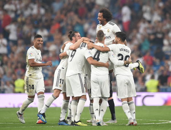 Karim Benzema (#9) of Real Madrid celebrates with teammates after scoring his teams second goal during the La Liga match between Real Madrid CF and CD Leganes at Estadio Santiago Bernabeu on September 1, 2018 in Madrid, Spain. (Aug. 31, 2018 - Source: Denis Doyle/Getty Images Europe)