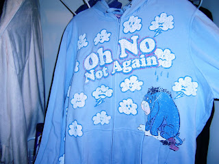 a blue hooded sweatshit with Eeyore on it and it says Oh no not again!!