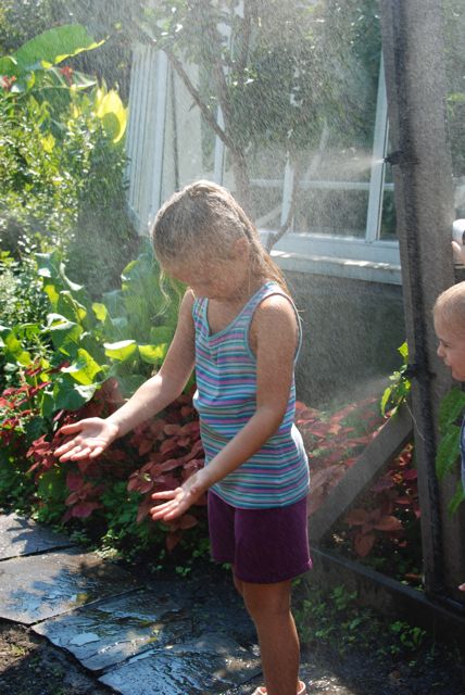 Now she is in the misty door frame at Phipps, with her brother happily pushing the button for her!