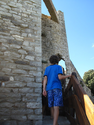 Climbing the towers and ramparts of Rocca de Leone in Casliglione Del Lago, Umbria,  Italy