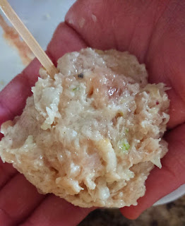 shaping the chicken mixture into round flat patties