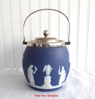 https://timewasantiques.net/products/wedgwood-england-biscuit-barrel-blue-jasperware-dip-blue-1895-sacrifice-figures