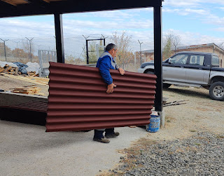 Bekir takes some Ondolin for the roof