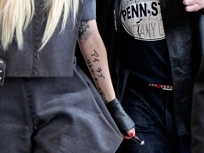 Lady Gaga Japanese Tattoo. Singer Lady Gaga gestures on