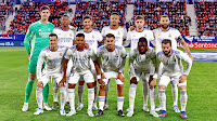 REAL MADRID C. F. Temporada 2021-22. Courtois, Alaba, Marco Asensio, Militao, Fede Valverde, Benzema. Lucas Vázquez, Rodrygo, Dani Ceballos, Camavinga y Nacho. CLUB ATLÉTICO OSASUNA 1 REAL MADRID C. F. 3 Miércoles 20/04/2022, 21:30 horas. Campeonato de Liga de 1ª División, jornada 33. Pamplona, Navarra, estadio El Sadar:  espectadores. GOLES: 0-1: 12’, David Alaba. 1-1: 13’, Budimir. 1-2: 45+4’, Marco Asensio. 1-3: 90+6’, Lucas Vázquez.