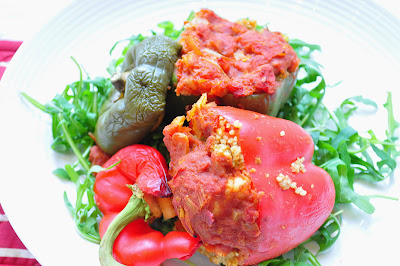 Couscous and Halloumi stuffed peppers with a tomato sauce