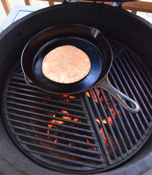 Cooking a pita in a dry cast-iron skillet on the Big Green Egg