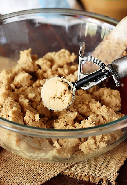 Scooping Peanut Butter Buckeyes Dough to Form Balls Image