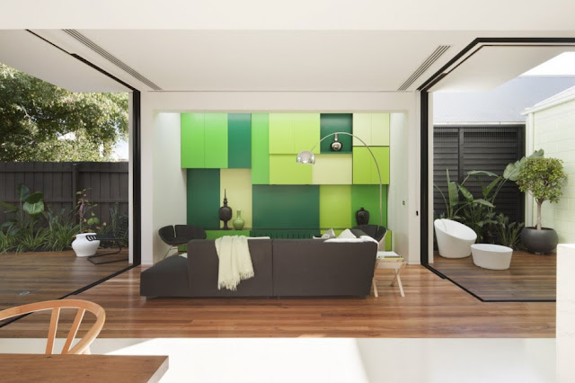 Small living room with green wall