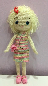 Emily, my crochet doll in rainbow dress, pink purse and pink mary janes