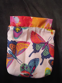 drawstring bag without drawstring, in butterfly print with abstract coordinating fabric casing