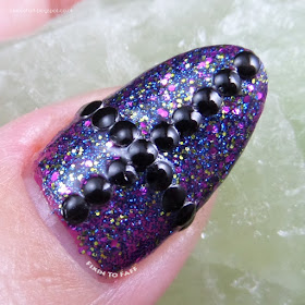 Gothic black and fuchsia nail art.