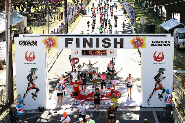 Runners at the finish line at Kapiolani Park Honolulu Marathon