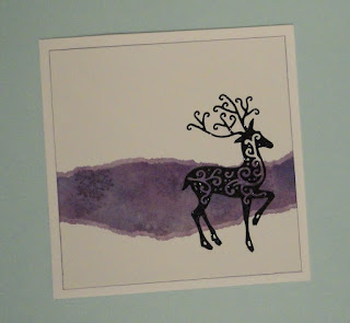 Christmas card with purple snowflake panel and black glitter reindeer