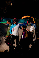 MTB Riders getting ready for second day Hiking and Biking : Posted by VJ SHARMA on www.travellingcamera.com : Hope you have already check other posts on MTB Himachal 2010 which talks about flag-off from Ridge ground, Rides during first day and some glimpses of this event... Today I am going to share some of the photographs of first morning(after camping) of this event... So here are few photographs of second day morning with some details about the activities around the camp side...Although there was sunlight but it was too cold in the morning... Many of us were hesitating to have bath there but finally we got motivated after seeing hot water on other corner of the camping ground... I think you can make a guess that why people are standing behind these tents and nobody in the front... Coz everyone is looking for sunlight and no one can't afford to stand in shadows :-)Mr. Dutta from Maharashtra assisting other rider in repairing the bike... Dutta ji, a passionate biker from Maharashtra who were bare feet throughout the journey... And you can also see that he is half T-Shirt... He is not worried about winters as he always lives like that irrespective of the season... A very humble and calm guy... Nice to meet you Dutta Ji !!!There were few folks who were leaving on second day... This includes some of the riders and few photographers... So everyone was saying bye to each other by getting appropriate details to be in touch... Here Runjhun (PHOTOQUEST participant) meeting Peter to say 'Good-Bye' and 'All the Best !'Due to rough and muddy roads, all the riders needed to take proper care of their bikes.... everyone used to clean and repair their cycles everyday... I was amazed to see people repairing their bikes with ease... They used to disassemble their bikes and re-assemble again after cleaning and repairing... Many times they used to talk about various types of bikes, companies, gears and other accessories... although I was not able to relate to most of the stuff... The only thing I noticed was that Military people and Nepali gang had best bikes in the camp...Folks are ready and just waiting for the final call from Marshals... Some of the riders are just warming up for the rides... On second day they had to ride till one point (?? KM) and then they had to cross a river to hike a mountain with their bikes.. This whole stretch of hiking was 12 Kilometers... It was very tiring... We were four  PHOTOQUEST participants who were together during this hiking session and all of us were down during the half way... Everyone was hungry and we were not carrying anything with us... On the way we asked for water at a local village an they gave us apples as well :-) ... Those Apples were amazing and now we had some energy to continue...  For rest of the story, I will share another post with Hike and Bike Photographs...Here is a photograph of Shainj School where we stayed during first night of MTB Himachal 2010... Lovely place under blue sky and surrounded by hills... Nothing like it !!!Here comes all the riders ready for various challenges of the day... The man in the front was a retired policeman and was there in MTB for first two days... When I asked 