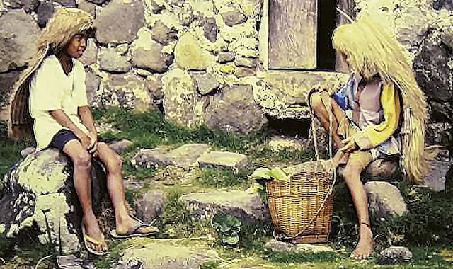 Ivatan children in front of a stone house