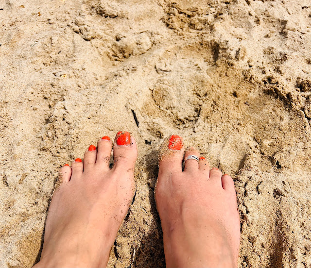 sandy feet on sand