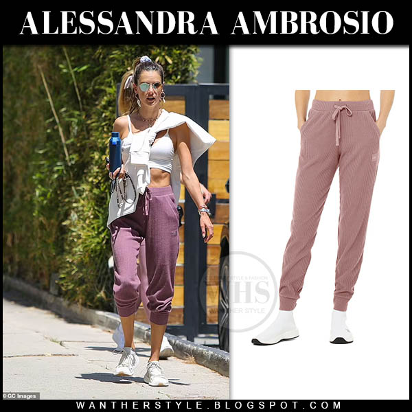 Alessandra Ambrosio in white sports bra and dark rose sweatpants