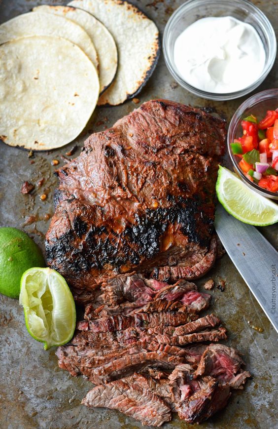 These flank steak street tacos are tender, and flavorful. Marinated in chipotle, garlic, lime flavors then cooked on a hot grill. 