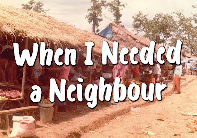 Song title superimposed over a picture of a poor village with houses featuring thatched roofs and many people