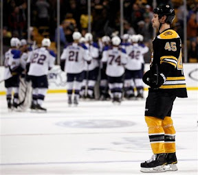 Bruins Mark Stuart skating off the ice