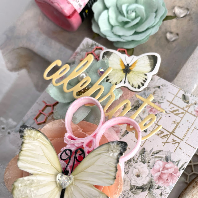 Birthday card created with: Prima Marketing miel collection paper, charms, flowers, chipboard stickers, strawberry milkshake lace trim, memory hardware pearls; Reneabouquets butterflies, glitter glass; Tim Holtz distress oxide in kitsch flamingo