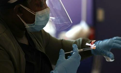 A nurse administers a COVID-19 vaccine during an event held by the San Francisco 49ers and other groups in Santa Clara, Calif., on April 8, 2021. (Justin Sullivan/Getty Images)