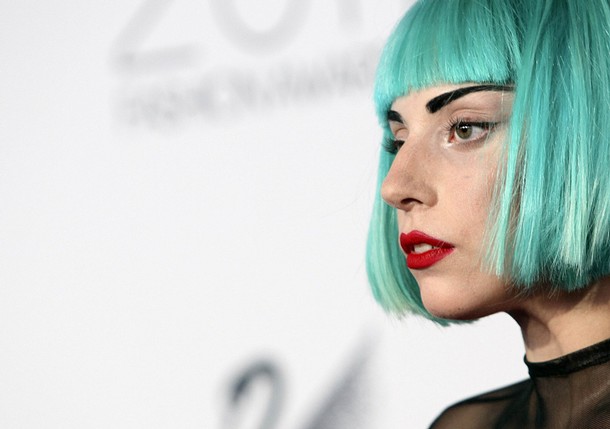 lady gaga 2011 fashion awards. Lady Gaga looks on on the red carpet at the CFDA Fashion awards at the