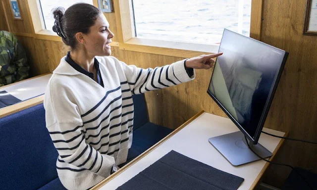 Crown Princess Victoria wore a new ivory cashmere navy striped jumper by Soft Goat. Marine Archaeological Museum