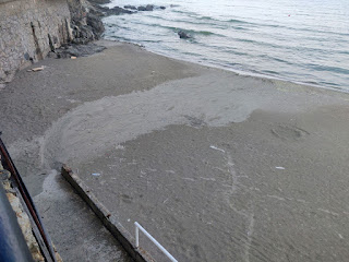 The run off from the storm on the beach