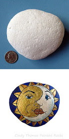 Moon and Sun Faces painted on a stone by Cindy Thomas