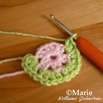 Pink and green circular motif of crocheting