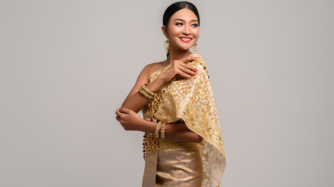 Women Wearing Thai Clothes and Right Hand Grasping Her Shoulders