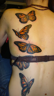 Full color Butterfly tattoos on girls back