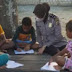 Polwan Polres Jayapura Ajak Anak-anak di Yobeh Belajar Membaca dan Menulis