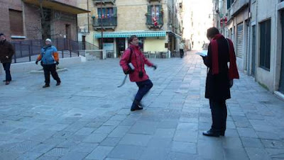 Fifth image of a phenomenally handsome and elegant scribe dancing in Venice.