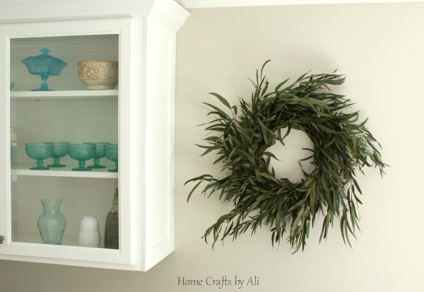 Eucalyptus wreath hanging on wall as home decor