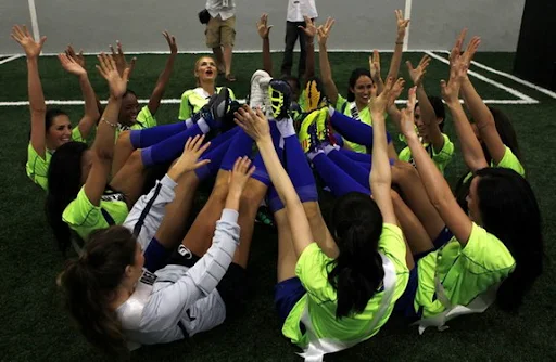 Miss Universe 2011 contestants pose for a picture before they play an exhibition football match