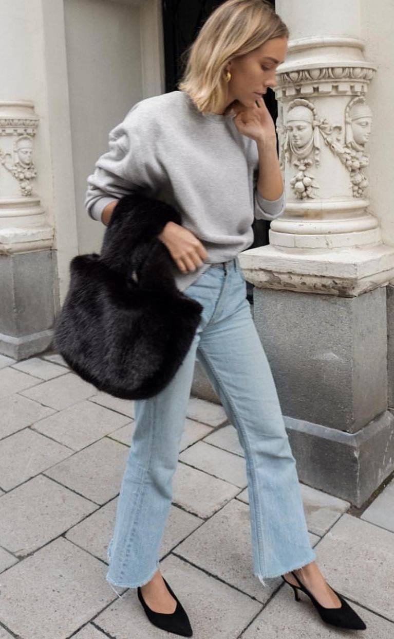 what to wear with a fur bag : grey sweater + jeans + heels