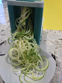 zucchini flowing from a spiralizer