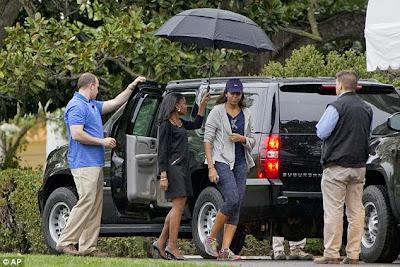 Flotus Michelle Obama ducking the sun? why? 