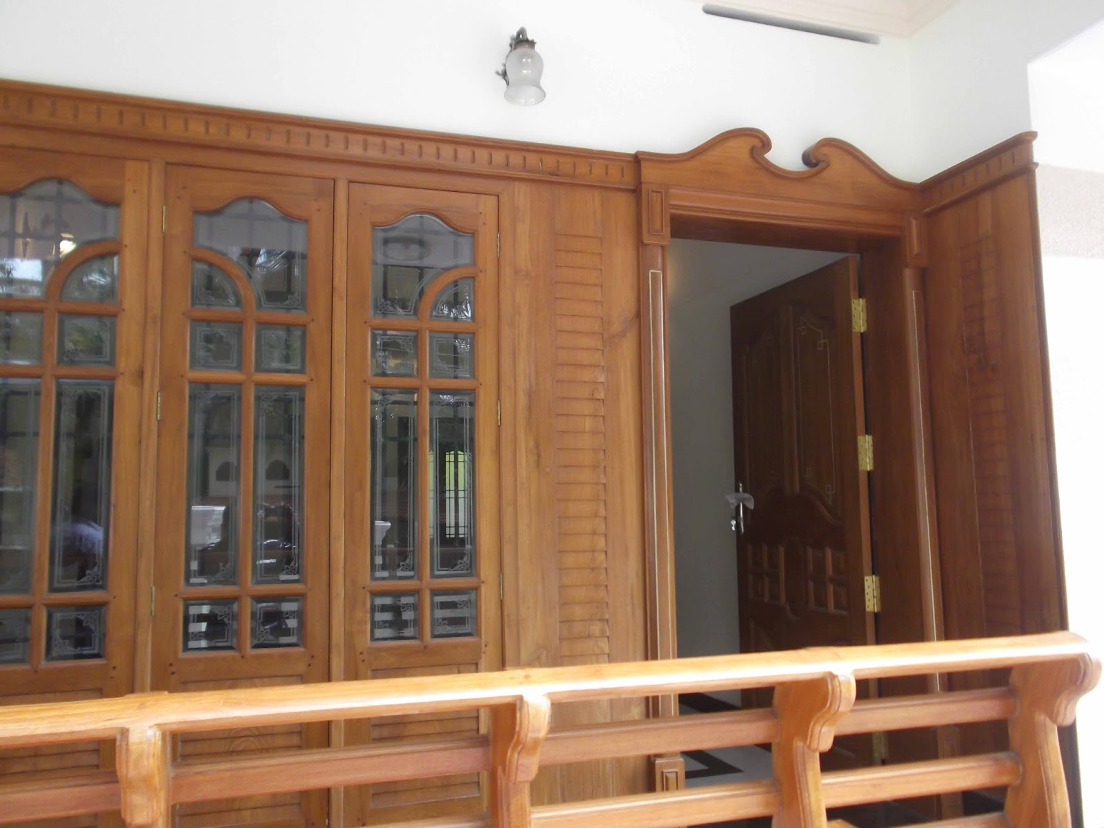 kerala style Carpenter works and designs: front entrance wooden doors 