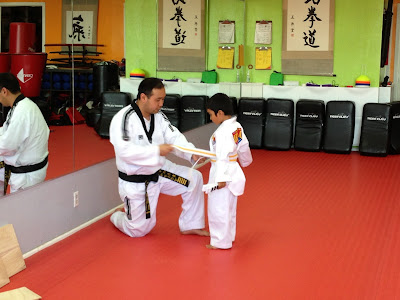 Rian received his promotion at Tae Kwon Do to yellow belt