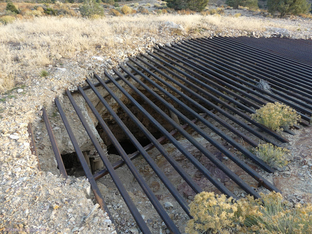 29: grid over the top of a wide and deep hole at a steep angle