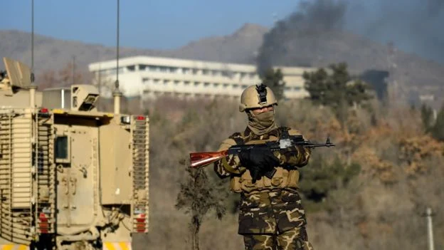 Image Attribute: Afghan security forces keep watch near the Kabul Intercontinental Hotel following the attack. Source: AFP