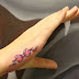 Ribbon tattoos on hand