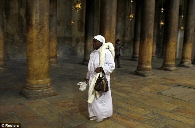 A Christian pilgrim arrives at the Church of the Nativity last night