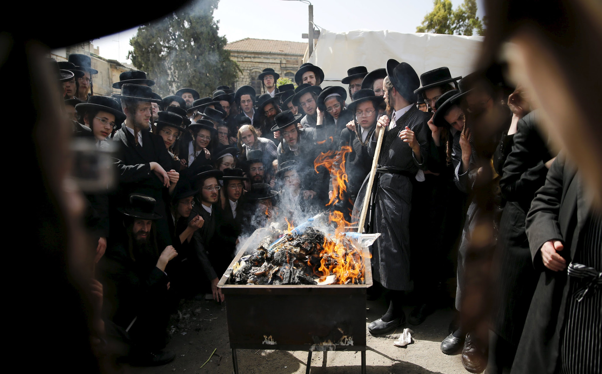 Ultra-Orthodox Jews burn leaven in the Mea Shearim neighbourhood of Jerusalem, ahead of the Jewish holiday of Passover...Ultra-Orthodox Jews burn leaven in the Mea Shearim neighbourhood of Jerusalem, ahead of the Jewish holiday of Passover, April 22, 2016. REUTERS/Ammar Awad